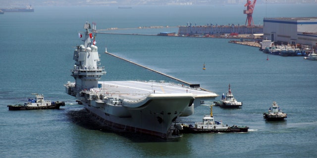 China's first domestically developed aircraft carrier is seen at a port on May 18, 2018, in Dalian after completing its first sea trials, in Liaoning province, China May 18, 2018.