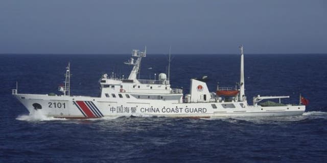 July 24, 2013: In this photo released by Japan's 11th Regional Coast Guard, a China Coast Guard ship numbered 2101 sails in waters 41 miles from the East China Sea islands called Senkaku by Japan and Diaoyu by China.