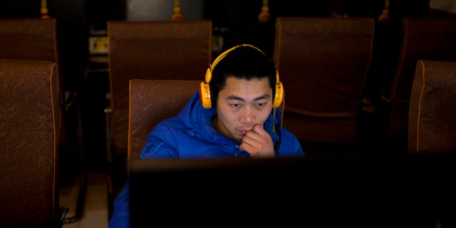 Dec. 28, 2012: A man uses a computer at an internet cafe in central Beijing, China.