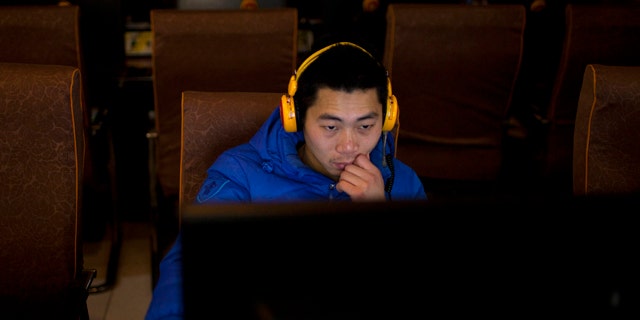 Dec. 28, 2012: A man uses a computer at an internet cafe in central Beijing, China.