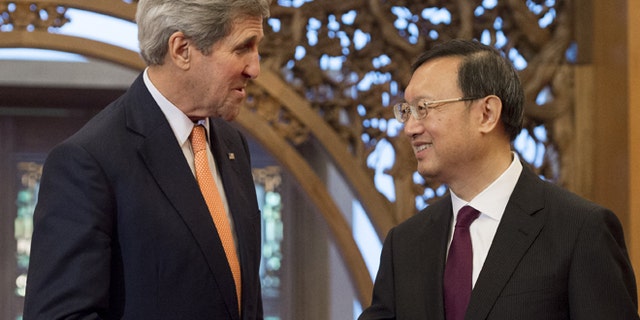 May 16, 2015: U.S. Secretary of State John Kerry, left, shakes hands with Chinese State Councilor Yang Jiechi at Diaoyutai State Guesthouse in Beijing. (AP)