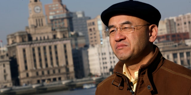 Jan. 28, 2013: Chinese-born U.S. scientist Hu Zhicheng stands at the waterfront promenade along the Huangpu River in Shanghai, China.