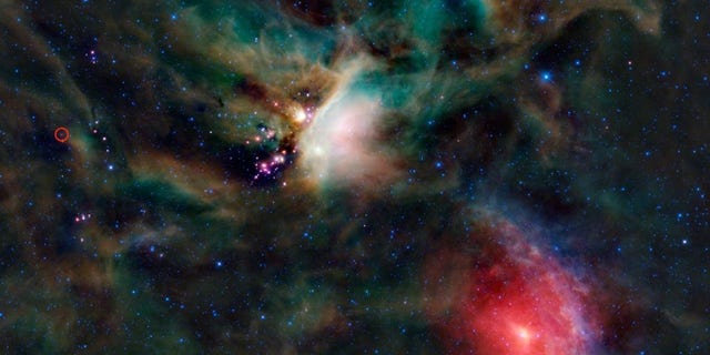 Organic compounds were identified in the protostar system IRAS 16293-2422. The young binary system sits in the Rho Ophiuchi cloud in the red circle on the left edge of this image.