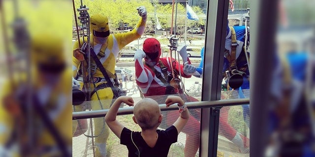 The hospital says the window washers are employees of Jenkintown Building Services, and that this isn't the first time they've dressed up for the children.