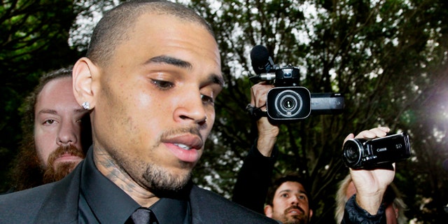Nov. 20, 2013: Singer Chris Brown arrives at court for a probation review hearing.