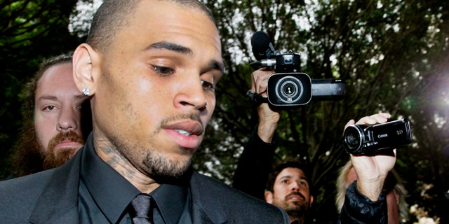 Nov. 20, 2013: Singer Chris Brown arrives at court for a probation review hearing.