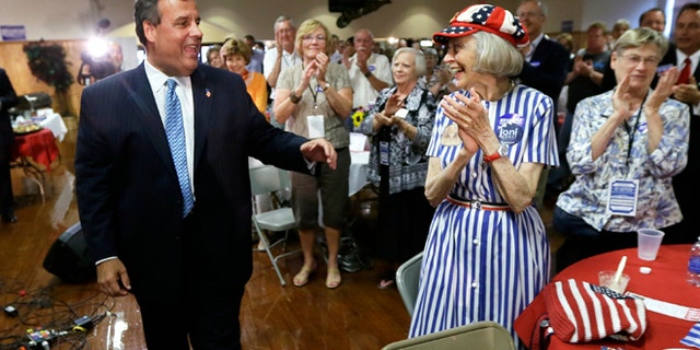 This July 17, 2014, file photo shows New Jersey Gov. Chris Christie greeting Iowans after speaking at a fundraiser for Iowa Gov. Terry Branstad in Davenport, Iowa.