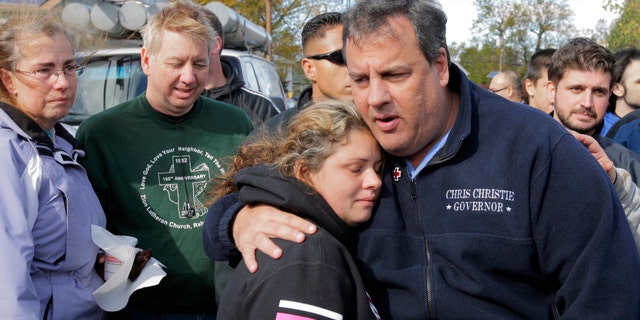 New Jersey Gov. Chris Christie comforts Kerri Berean, 33, a Chapman Street resident, in this Nov. 3, 2012 taken in Little Ferry, N.J.