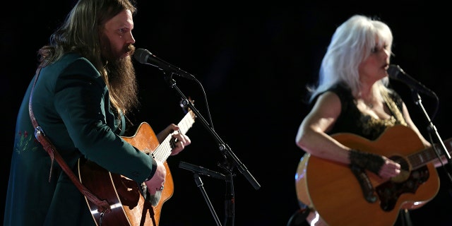 Chris Stapleton and Emmylou Harris perform "Wildflowers" during an In Memoriam tribute to Tom Petty at the 60th annual Grammy Awards at Madison Square Garden on Sunday, Jan. 28, 2018, in New York.