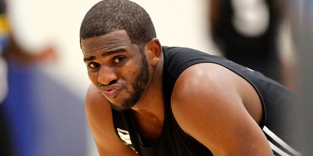 Dec. 9, 2011: New Orleans Hornets guard Chris Paul reacts during the first day of their NBA basketball training camp in Westwego, La.