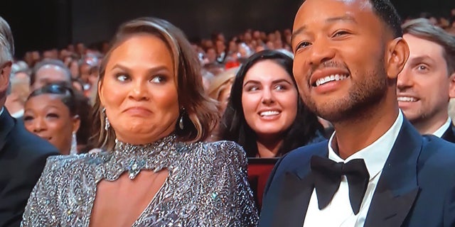 Chrissy Teigan addresses her Emmy Awards facial expression after awkward Colin Jost and Michael opening monologue joke.