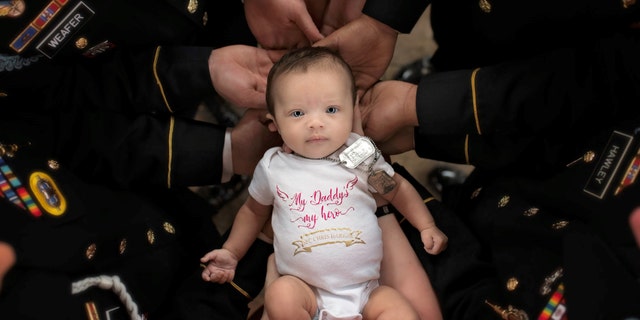 Christian Michelle Harris was born several months after her father was killed in Afghanistan.