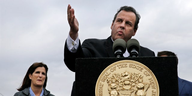 Oct. 29, 2014: As wife Mary Pat Christie, left, looks on, New Jersey Gov. Chris Christie tells heckler Jim Keady to: "Sit down and shut up," during a event marking the second anniversasry of Superstorm Sandy