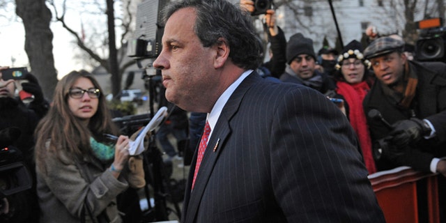 Jan 9, 2014: New Jersey Gov. Chris Christie walks past reporters as he leaves City Hall in Fort Lee, N.J.