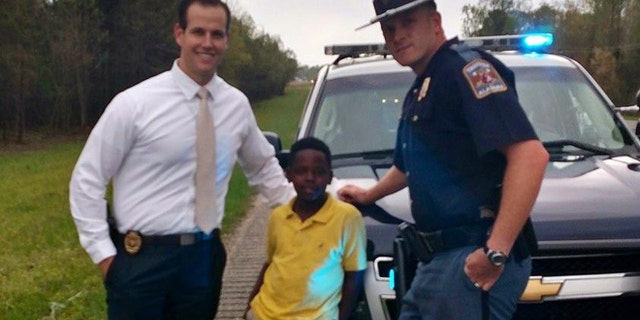 Ala. AG Investigator Eric Salvador, Christopher Wheeler, the young hero, and Trooper Lee Walls. (ALEA)