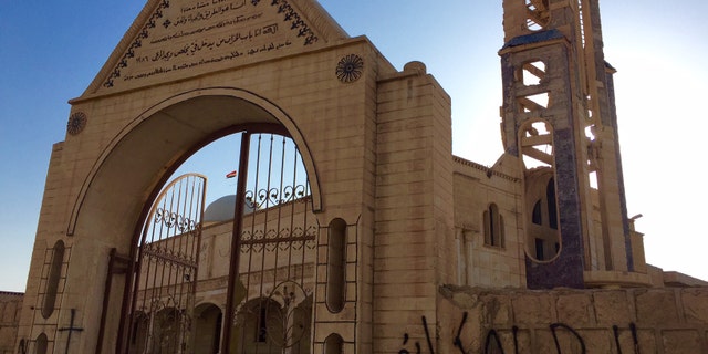 Hamdaniya church scarred by ISIS and fighting.