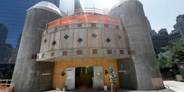 File 2017: A construction worker walks in front of the St. Nicholas National Shrine in New York.