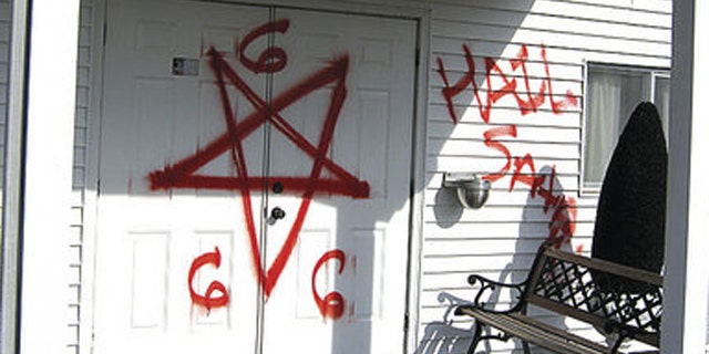 Bright red spray-paint was used to write "Hail Satan" and "666"outside walls of Gospel Light Missionary Baptist Church.