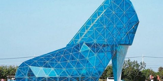The massive, high-heeled shaped house of worship is made almost entirely out of glass.
