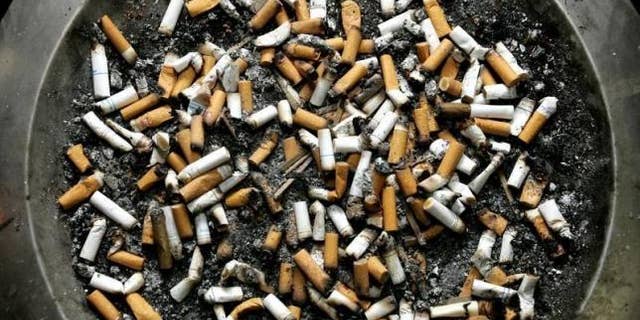 Feb. 21, 2005: Cigarette butts lie in an ashtray outside a Montreal office building.