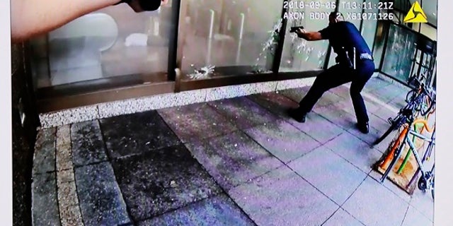 Body camera footage showed police shooting at glass as Omar Enrique Santa Perez was seen lying on the ground.