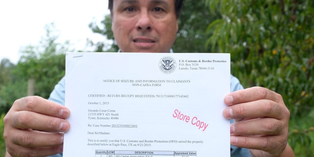 Gerardo Serrano showing the notice of seizure he received when his truck was seized.
