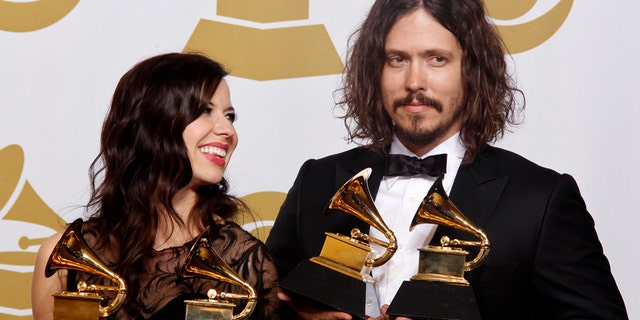 Joy Williams and John Paul White of The Civil Wars hold their awards for "Best Country Due/Group Performance and Best Folk Album" (Barton Hollow) at the 54th annual Grammy Awards in Los Angeles, California, February 12, 2012.