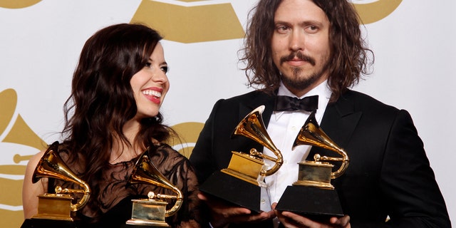 Joy Williams and John Paul White of The Civil Wars hold their awards for "Best Country Due/Group Performance and Best Folk Album" (Barton Hollow) at the 54th annual Grammy Awards in Los Angeles, California, February 12, 2012.