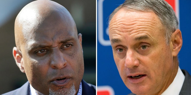 Major League Baseball Players Association executive director Tony Clark, left, and Commissioner Rob Manfred.