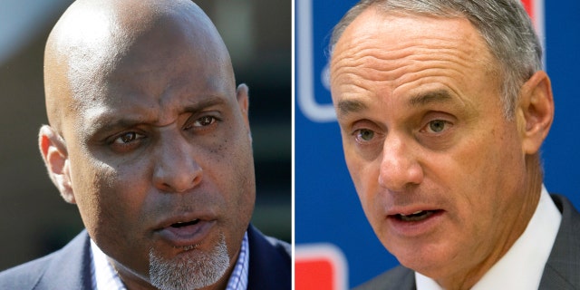 Major League Baseball Players Association executive director Tony Clark, left, and Commissioner Rob Manfred.
