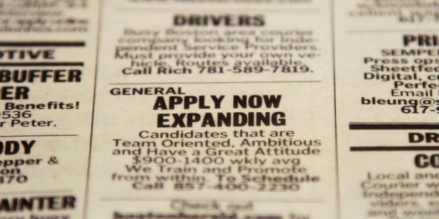 FILE - In this Tuesday, Dec. 11, 2012 file photo, an advertisement in the classified section of the Boston Herald newspaper calls attention to possible employment opportunities in Walpole, Mass. U.S. employers added 155,000 jobs in December, a steady gain that shows hiring held up during the tense negotiations to resolve the fiscal cliff. The solid job growth wasnât enough to push down the unemployment rate, which remained 7.8 percent last month, the Labor Department said Friday, Jan. 4, 2013. The rate for November was revised up from an initially reported 7.7 percent. (AP Photo/Steven Senne, File)