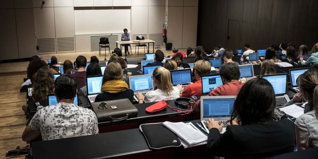 Students of the Catholic University of Lyon use laptops to take notes in a classroom, on September 18, 2015 in Lyon, eastern France. AFP PHOTO / JEFF PACHOUD (Photo credit should read JEFF PACHOUD/AFP/Getty Images)