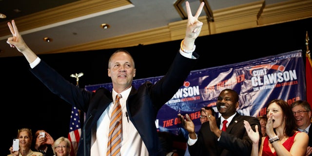 April 22, 2014: Curt Clawson celebrates along with a cheering crowd at his election party at the Hyatt Regency Coconut Point in Bonita Springs, Fla.