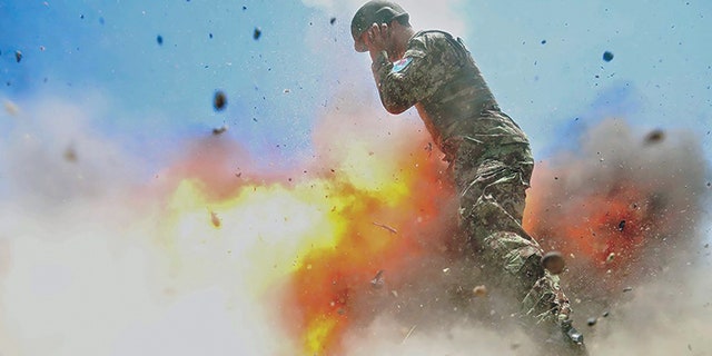 A mortar tube accidentally explodes during an Afghan National Army live-fire training exercise in Laghman province, Afghanistan, July 2, 2013. This photo was taken by U.S. Army Spc. Hilda Clayton, who died in the blast.