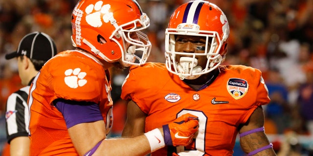 Dec. 31, 2015: Clemson running back Wayne Gallman (9) is congratulated by tight end Stanton Seckinger (81) during the second half of the Orange Bowl NCAA college football semifinal playoff game against Oklahoma in Miami Gardens, Fla. (AP Photo/Joe Skipper)
