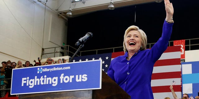 Hillary Clinton takes the stage at a rally, Monday, June 6, 2016, in Long Beach, Calif.