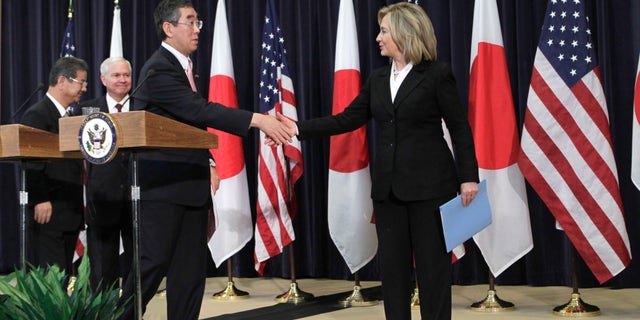 Tuesday: Secretary of State Hillary Rodham Clinton shakes hands with Japanese Foreign Minister Takeaki Matsumoto at a news conference at the State Department.