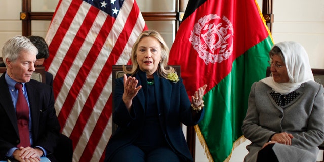 Oct. 20, 2011: U.S. Secretary of State Hillary Rodham Clinton, center, hosts a Civil Society roundtable discussion at the U.S. Embassy in Kabul, Afghanistan. Flanking Clinton are U.S. Ambassador Ryan Crocker, left, and Dr. Sima Samar.