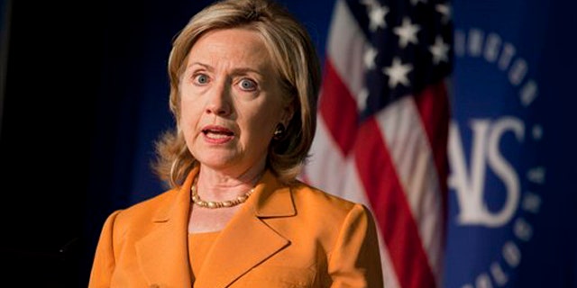 Secretary of State Hillary Clinton gestures while speaking about the global health initiative Aug. 16 in Washington. (AP Photo)