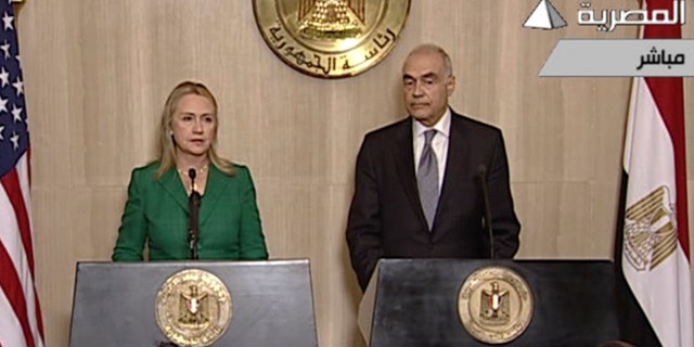 Nov. 21, 2012: In this image made from Egyptian State Television, U.S. Secretary of State Hillary Rodham Clinton, left, and Egyptian Foreign Minister Mohammed Kamel Amr, right, give a joint news conference announcing a cease-fire between Israel and Hamas in Cairo, Egypt.