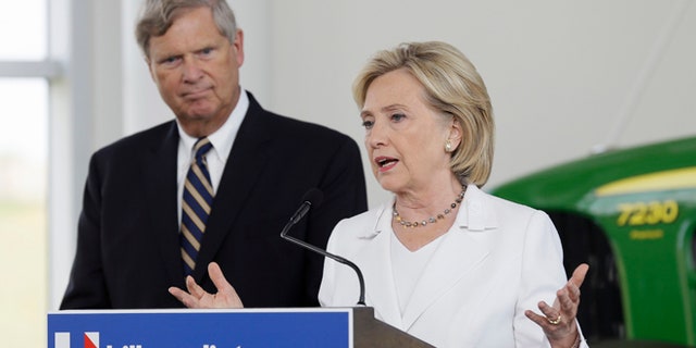 Aug 26, 2015: Democratic presidential candidate Hillary Rodham Clinton, accompanied by Agriculture Secretary Tom Vilsack, speaks during a news conference at the Des Moines Area Community College in Ankeny, Iowa. (AP)