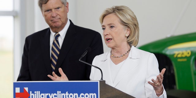 Aug 26, 2015: Democratic presidential candidate Hillary Rodham Clinton, accompanied by Agriculture Secretary Tom Vilsack, speaks during a news conference at the Des Moines Area Community College in Ankeny, Iowa. (AP)
