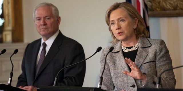 Nov. 8: U.S. Secretary of Defense Robert Gates and U.S. Secretary of State Hillary Rodham Clinton at a news conference at Government House in Melbourne, Australia. Clinton wishes for Gates to remain in office saying, ‘We came in together, we should go out together. That's my theory.’