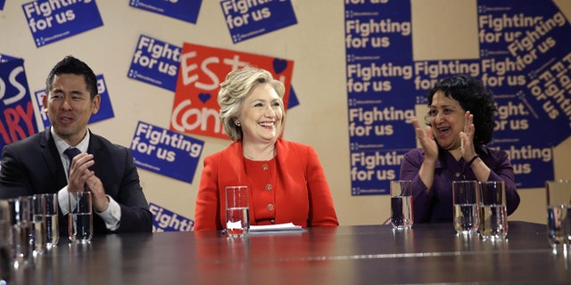 April 13, 2016: Democratic presidential candidate Hillary Clinton talks with local politicians and immigrant activists in New York.