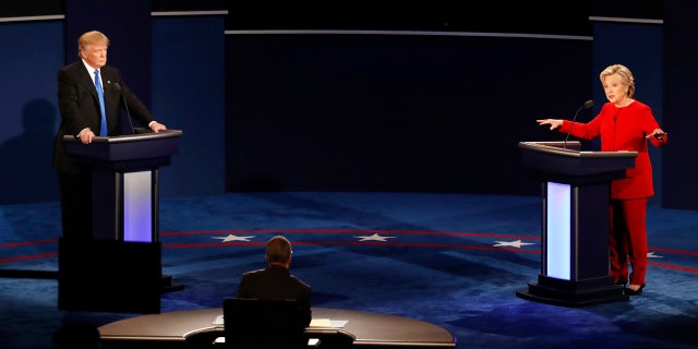 Democratic presidential nominee Hillary Clinton gestures as she appears on stage with Republican presidential nominee Donald Trump during the presidential debate at Hofstra University in Hempstead, N.Y., Monday, Sept. 26, 2016.