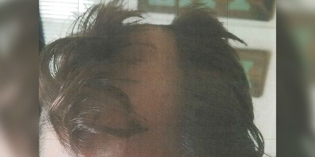 This bad haircut and a wounded ear have left a Wisconsin hairstylist under arrest, authorities said. (Madison Police Department)