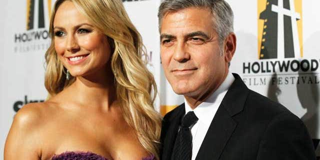 October 25, 2011: George Clooney and Stacy Keibler at the 15th Annual Hollywood Awards Gala in Beverly Hills.