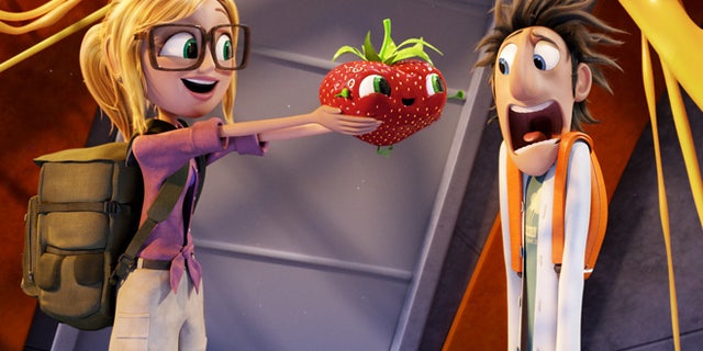 This film image released by Sony Pictures Animation shows characters, from left, Sam Sparks, voiced by Anna Faris, Barry the Strawberry, voiced by Cody Cameron, and Flint Lockwood, voiced by Bill Hader in a scene from "Cloudy with a Chance of Meatballs."