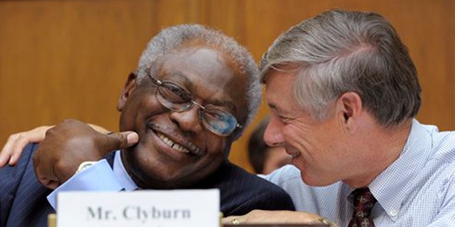 Rep. James Clyburn, left, shares a laugh with Rep. Fred Upton, right, before the start of the Joint Select Committee on Deficit Reduction meeting in Washington Sept. 8.