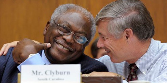 Rep. James Clyburn, left, shares a laugh with Rep. Fred Upton, right, before the start of the Joint Select Committee on Deficit Reduction meeting in Washington Sept. 8.